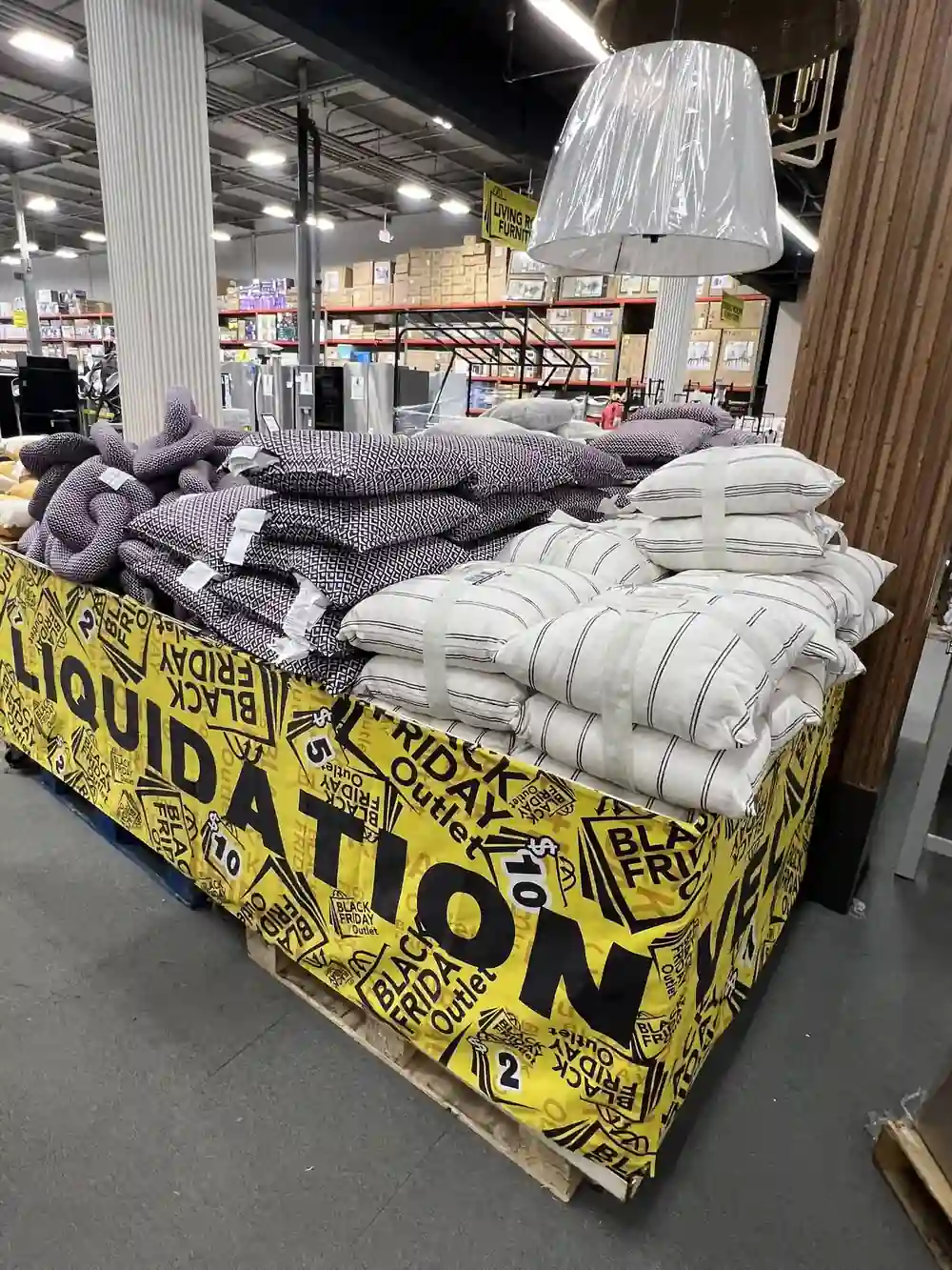 Custom business banner around a home furnishing display in a retail store