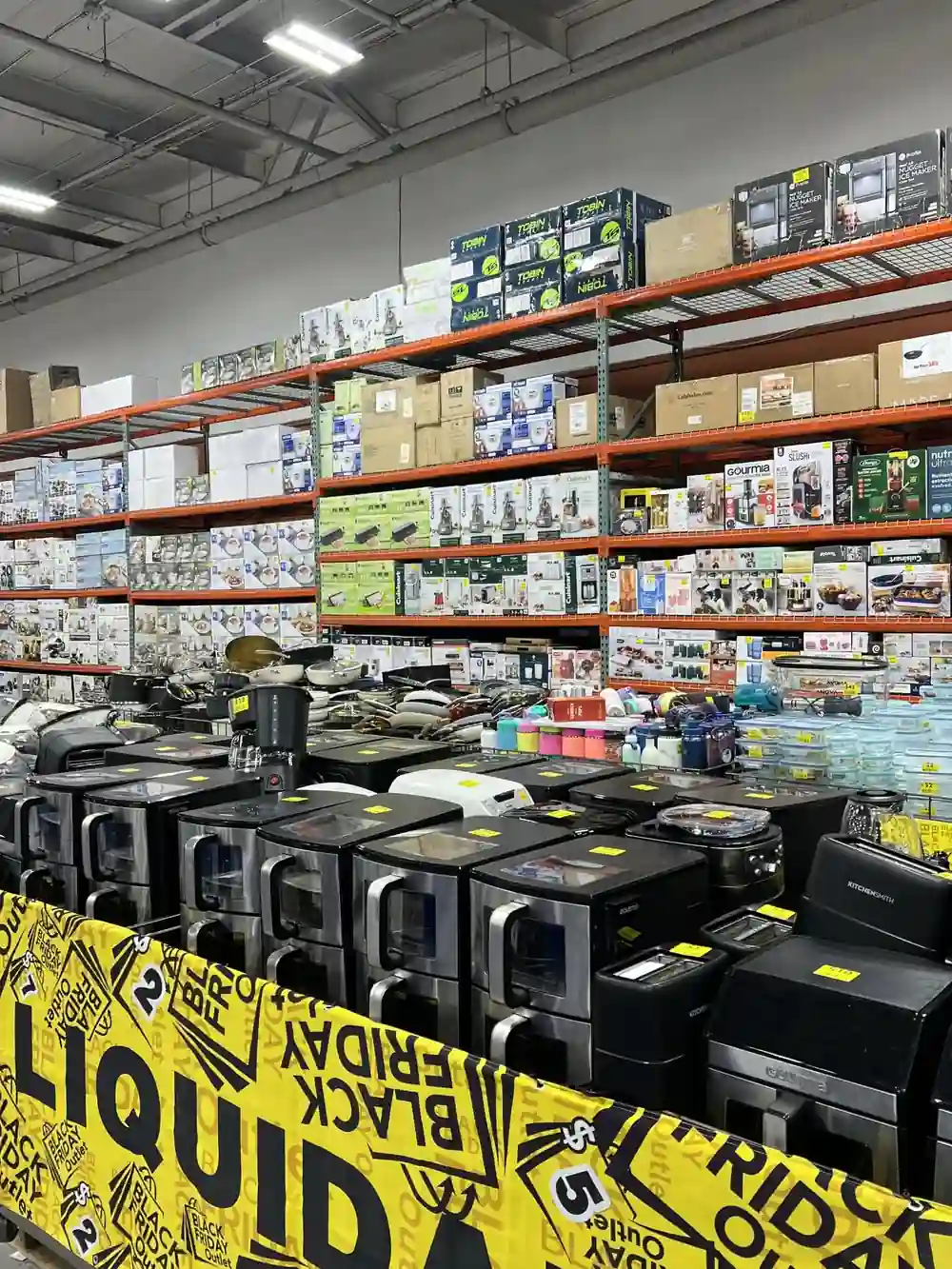 Indoor promo banner surrounding a small-appliance display in a discount store
